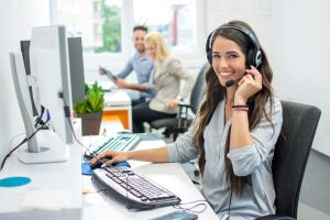 Smiling,Friendly,Female,Call-center,Agent,With,Headset,Working,On,Support
